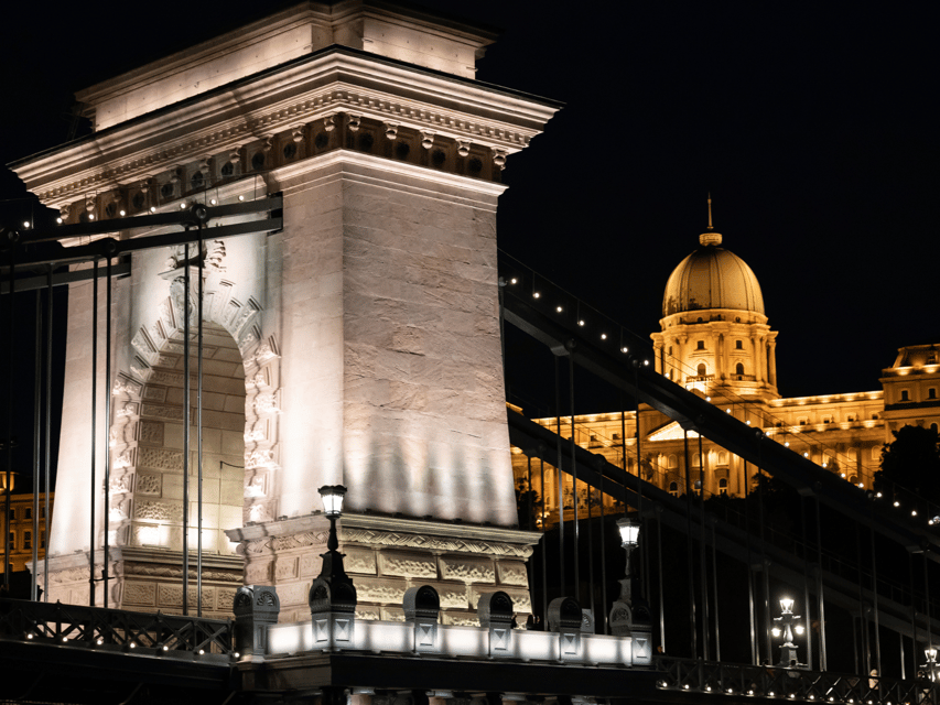 Budapest: BBQ Dinner Cruise w/ Live Music & Unlimited Drinks - Landmark views: Parliament, Liberty Bridge, and the lit-up skyline
