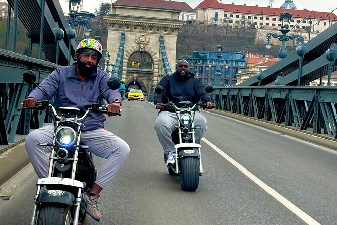 Monster Bike Sightseeing Tour – City Budapest on Electric Rollers - Chain Bridge crossing and Shoes on the Danube Bank: a shift from scenic to solemn